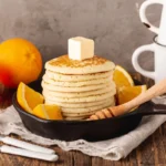 How do you reheat Cracker Barrel pancakes? Freshly reheated pancakes on a white plate.